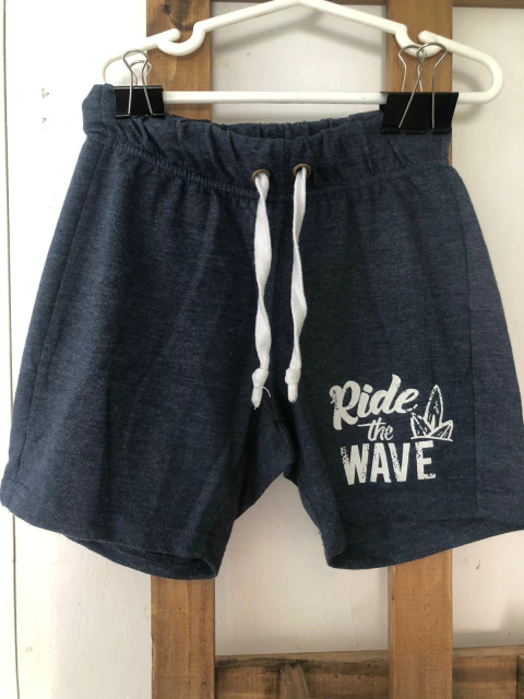 Short azul de algodón "Ride the wave". Talle 6 años.