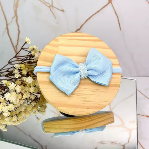 Faixa de bebê laço cruzado