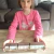niñas mostrando números largos montessori