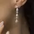 Brinco Gota Cascata Cravejado Banho Ródio Branco na internet