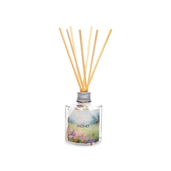 Frasco transparente de difusor para ambientes de aroma Monet com varetas, da marca Mels Brushes, imagem com fundo branco.