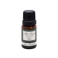 Frasco de essência de 10ml da Mels Brushes com a fragrância Cedro e Magnólia e tampa preta rosqueável.
