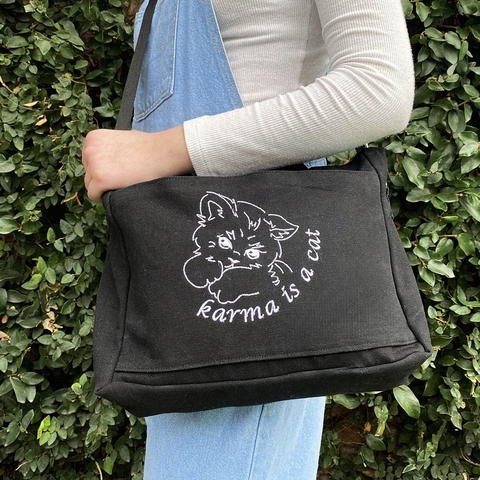 Karma black messenger bag
