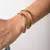 Duas Pulseiras Redondas Lisas - Ouro e Ródio - comprar online