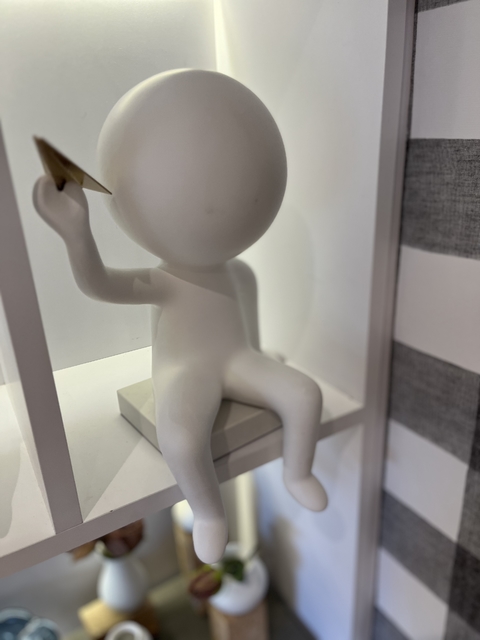 Escultura boneco aviãozinho