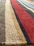Tapete artesanal Kilim Listrado em chenile colorido.