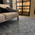 Imagem do Tapete artesanal Tear em chenile azul marinho, algodão cru e sisal natural.