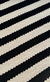 Tapete artesanal Tear Listrado em chenile cru e preto. - comprar online