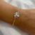 Pulsera flor mediana en plata ley 950