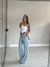 Calça Jeans Spezia lavagem clara com tomara que caia branca  use sôffi