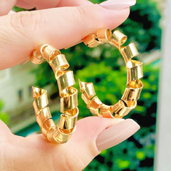 BRINCO ARGOLA DE MOLA ESPAÇADA - BANHADO A OURO 18K - comprar online