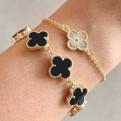 PULSEIRA COM TREVOS PRETOS PEQUENOS - BANHADO A OURO18K - comprar online