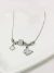 Colar Pingentes Borboleta, Trevo e Pedrinhas Aço Inox - comprar online