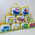 Bolsa personalizada com ilustrações de meios de transporte, incluindo barcos, aviões e carros, em cores vibrantes.