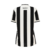 Camisa feminina do Botafogo, preta e branca, com listras verticais e patch do campeão da Libertadores 2024 na parte de trás.
