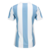 Camisa feminina azul e branca da Argentina 2025/26, com design listrado e logo da Adidas na parte de trás.
