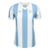 Camisa feminina Argentina 2025/26 comemorativa de 1974, nas cores azul e branco, com detalhes em dourado e logo da Adidas.