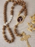 Terço Cordão com Foto - Marrom/Dourado - comprar online