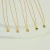 Colar Dourado Ponto de Luz em Aço Inoxidável na internet