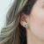 Imagem do Brinco Earcuff Zirconias Branco/Verde em Aço Inoxidável