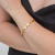 Bracelete Dourado Encaixe Detalhado em Aço Inoxidável - comprar online