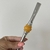 Bomba de Inox com Pedra Dourada - comprar online