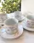 Xícara com pires 'Encanto'