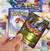 Mega Combo Álbum De Cartas Pókemon Tcg + Lata Especial - tienda online
