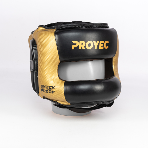 Cabezal de boxeo Proyec Blocker en colores negro y dorado, modelo shock proof, ideal para protección en entrenamientos de boxeo.