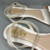Sandália rasteira flat aplicação de flor e trançada no tornozelo off white na internet