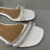 Sandália Rasteira Flat Branca Envernizada Com Tiras Brilhosas - comprar online
