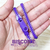Foto: Pulseira zíper de plástico cor roxo liso (totalmente roxo).