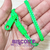 Foto: Pulseira zíper de plástico cor verde liso (totalmente verde).