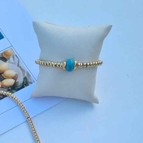 PULSEIRA TÂNIA COM PEDRA TURQUESA E ESFERAS BANHADAS A OURO