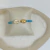 PULSEIRA BRISA PEDRAS TURQUESA E BANHO DE OURO na internet