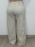 Calça pantalona textura em linho com botões dourado bege na internet