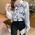 Blusa de Alicia en el País de las Maravillas