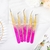 Pinza Dorada con Rosa en internet