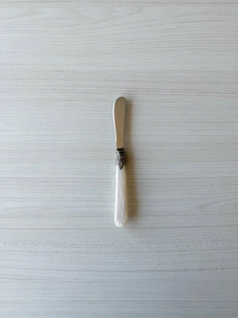 UNTADOR ACERO PLATEADO CABO NACARADO - comprar online