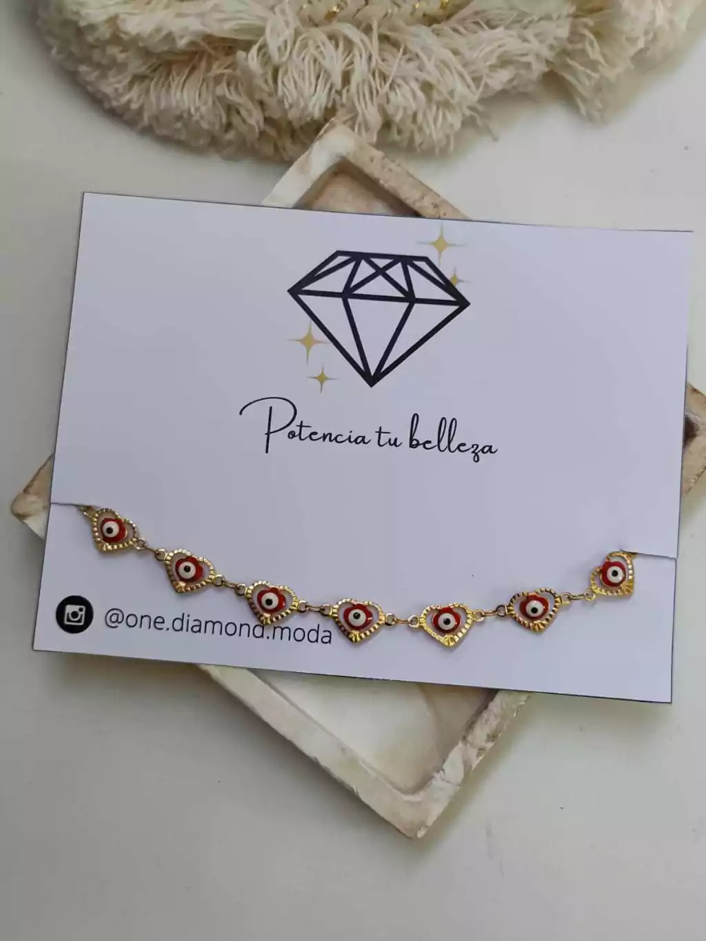 TOBILLERA CORAZONES C/OJITOS- DORADA