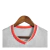 comprar-a-camisa-liverpool-away-24-25-torcedor-simbolo-da-nike-em-pe-masculina-branca-com-detalhes-em-vermelho-loja-tealto-sports