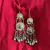 Aretes Kuchi de chichita con cadenas y sonajas