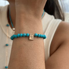 Imagem do Pulseira Cruz Howlita Turquesa
