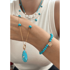 Pulseira Cruz Howlita Turquesa - Be lure