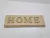 Base de pinus com palavra Home( 30x10) na internet