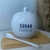 Açucareiro de porcelana com colher