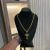 CORRENTE CADEADO PONTA BATIDA FECHO CANHÃO (9,5MM) + PINGENTE CRUCIFIXO TRIDIMENSIONAL COM MICROCRAVAÇÃO DE ZIRCÔNIAS (4CM) - PRATA COM OURO 18K