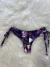 Calcinha biquíni regulável fio duplo estampa fundo preto com roxo - comprar online