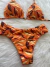 Biquíni com calcinha tanga laranja estampado - Flor Morena
