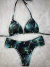 Conjunto top cortininha + calcinha tanga fundo preto com passaros